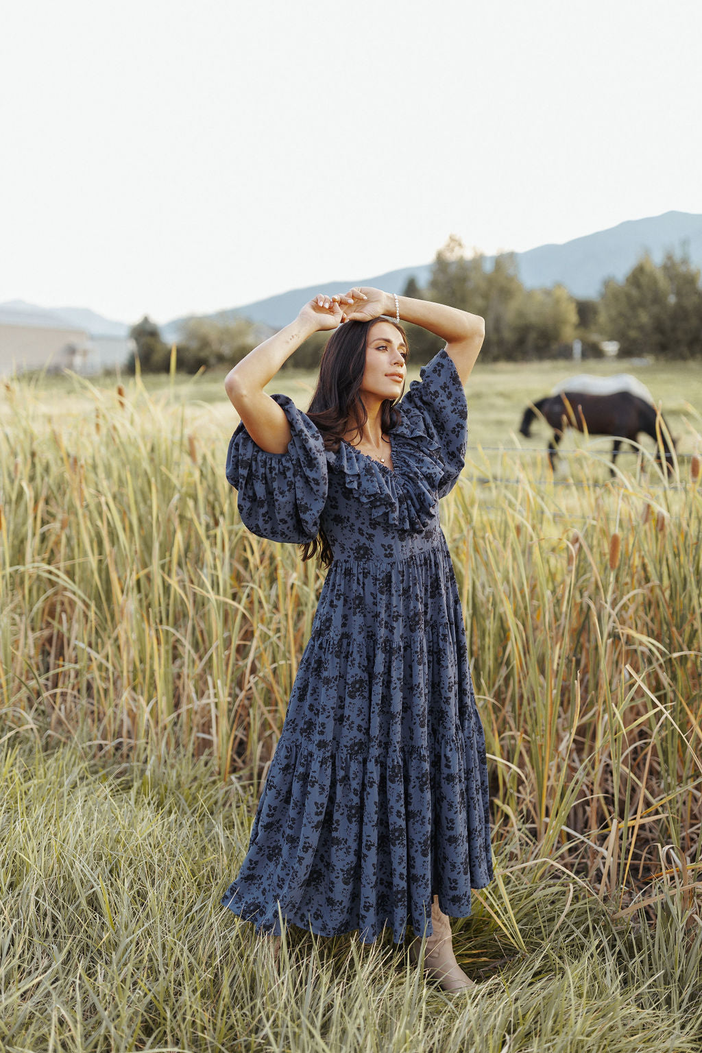 woman wearing bump friendly navy blue floral maxi dress with flowy sleeves and flowy skirt, perfect for bridal showers, weddings, church, baby showers, special events, easter and family photo shoots