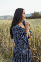 woman wearing bump friendly navy blue floral maxi dress with flowy sleeves and flowy skirt, perfect for bridal showers, weddings, church, baby showers, special events, easter and family photo shoots