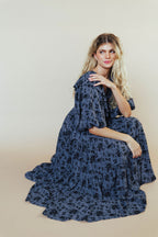 woman wearing bump friendly navy blue floral maxi dress with flowy sleeves and flowy skirt, perfect for bridal showers, weddings, church, baby showers, special events, easter and family photo shoots