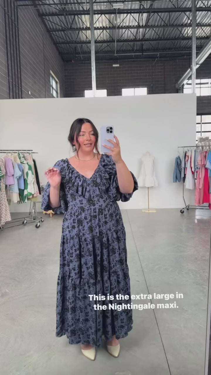 woman wearing bump friendly navy blue floral maxi dress with flowy sleeves and flowy skirt, perfect for bridal showers, weddings, church, baby showers, special events, easter and family photo shoots
